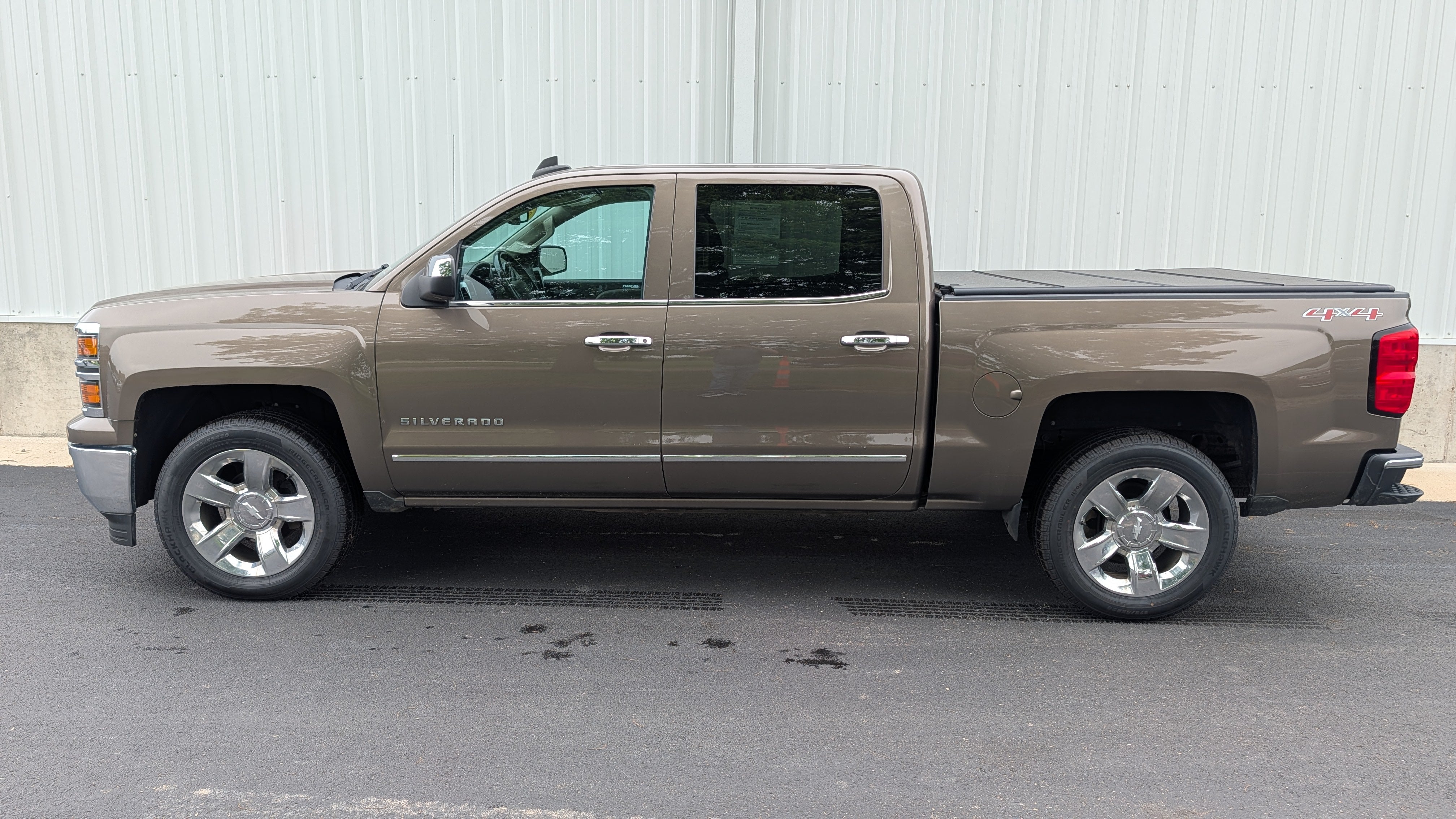 2015 Chevrolet Silverado 1500 LTZ in Brownstone Metallic — front three-quarter view